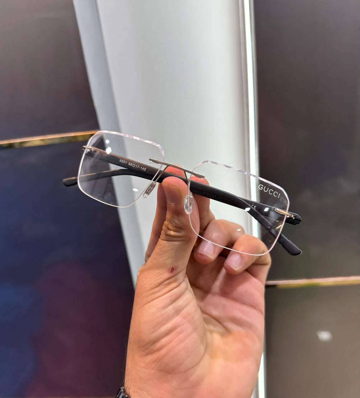 Gucci Men’s Rimless Transparent Eyeglasses